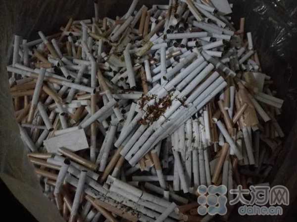 郑州警方查获30余吨假冒名贵香烟 仓库堆积如小山
