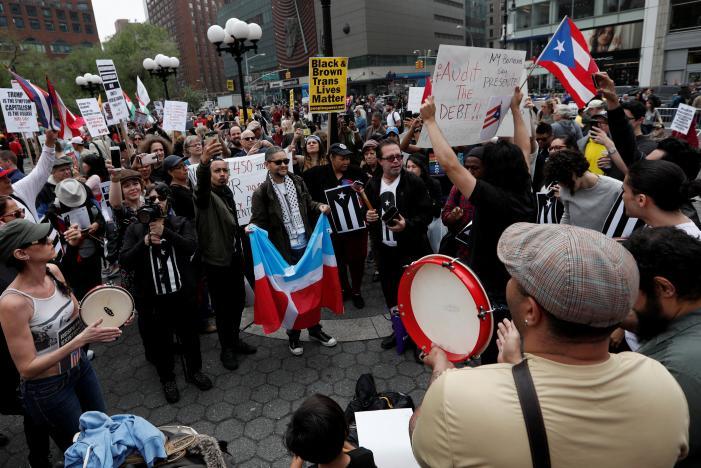 Demonstrators gather during a May Day protest in New York
