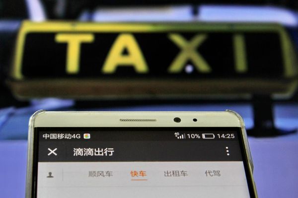 外媒关注中国网约车新政一周年:司机门槛提高 城市拥堵缓解