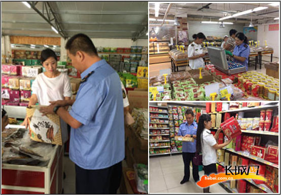 工作人员对食品进行检查。赵会英 供图