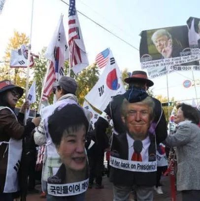 特朗普还没到，韩国有些人已举星条旗高呼“救星”了