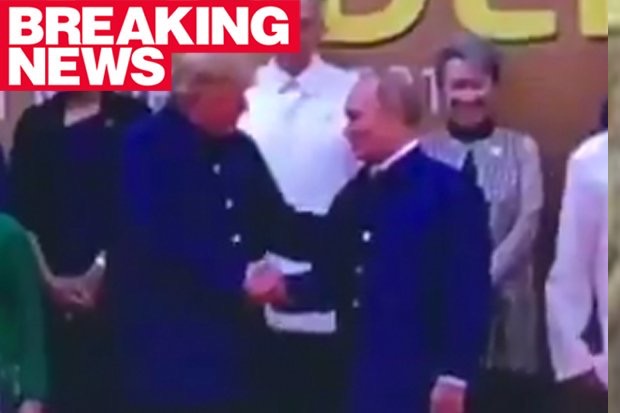 特朗普和普京在APEC峰会上互致问候并握手