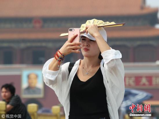 资料图：北京骄阳似火，热浪袭人。图片来源：视觉中国